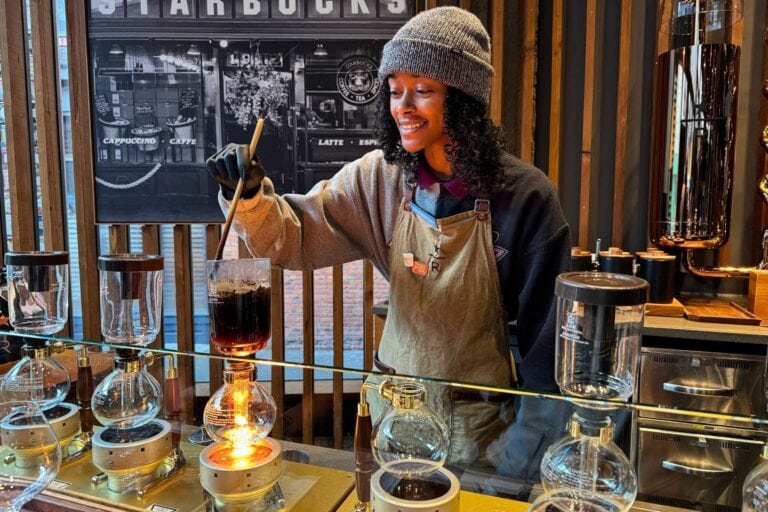Barista K.C. Jones brews up coffees from around the world as part of the Coffee Lab: Journey of the Senses experience at Seattle's Starbucks Reserve Roastery, one of six around the world that focus on small-batch reserve coffees. Photo by Pat Lee