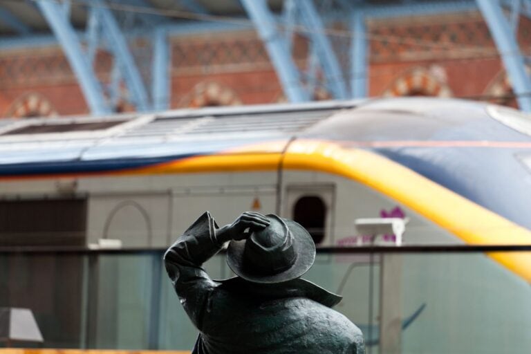 Sir John Betjeman greets the Eurostar at St Pnacras Station. Image by Backyard Productions via Canva