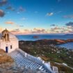 A chapel perched above Serifos's port town of Livadi. Photo by milangonda from Getty Images via Canva