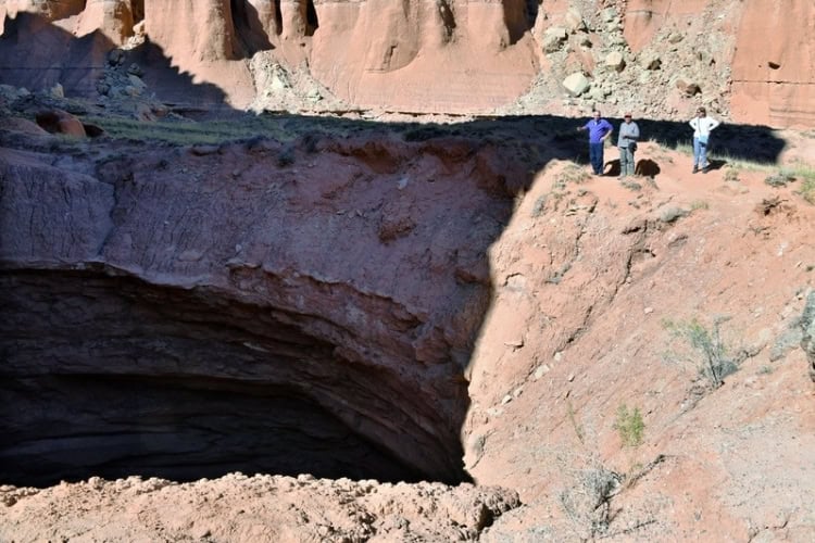 The 200-foot-deep Gypsum Sinkhole on the Cathedral Valley Loop. Photo by Tab Hauser