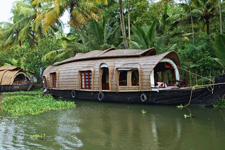 Converted wooden rice barges known as Kattuvallam Houseboats offer a dreamy way to explore The Backwaters. Photo by Ted Alan Stedman