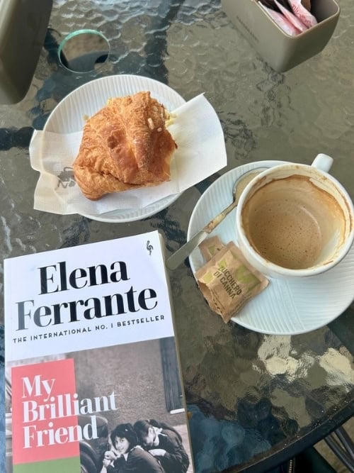 Enjoying a coffee, a pastry, and a good book. Photo by Monique Evdokiou