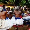 Gyrating dancers on Voodoo Festival Day in the Secret Garden of Ouidah. Photo by Edward Placidi