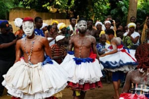Gyrating dancers on Voodoo Festival Day in the Secret Garden of Ouidah. Photo by Edward Placidi