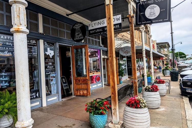 The wide sidewalks provide easy access to an array of boutiques and shops housed in well-preserved 19th century buildings