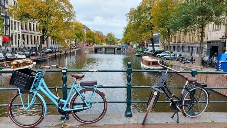 Bicycles outnumber people in the Netherlands, with these locked on an Amsterdam canal bridge a typical sight. Photo by Richard Varr