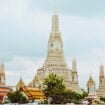 Boats in front of a temple in Bangkok, Thailand. Photo by Evan Krause, Unsplash