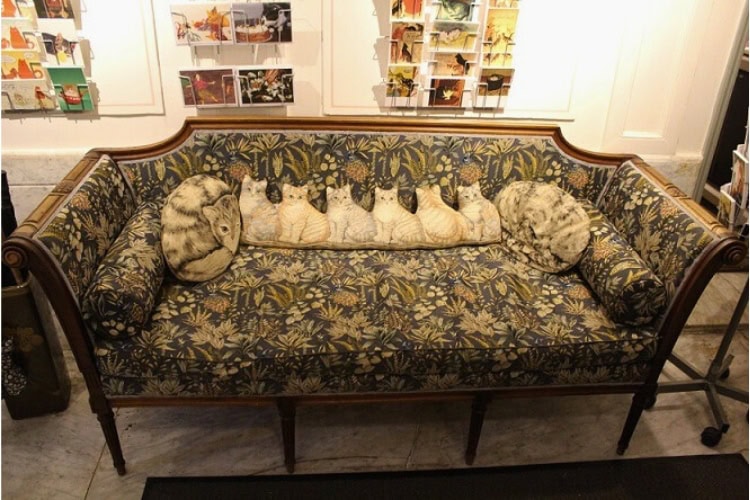 A sofa with cat pillows and postcards for sale at the Kattenkabinet, the Cat Museum at 497 Herengracht. Photo by Richard Varr
