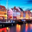 Colorful Nyhavn in Copenhagen by night. Image by scanrail from Getty Images Pro via Canva