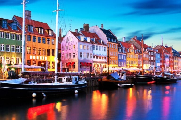 Colorful Nyhavn in Copenhagen by night. Image by scanrail from Getty Images Pro via Canva