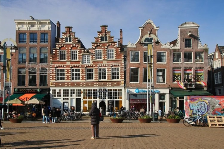 Homes at Amsterdam's Nieuwmarkt Square showcasing gable styles, including Dutch Classicism, rococo, Renaissance design, and neoclassical style. Photo courtesy of Mark Law