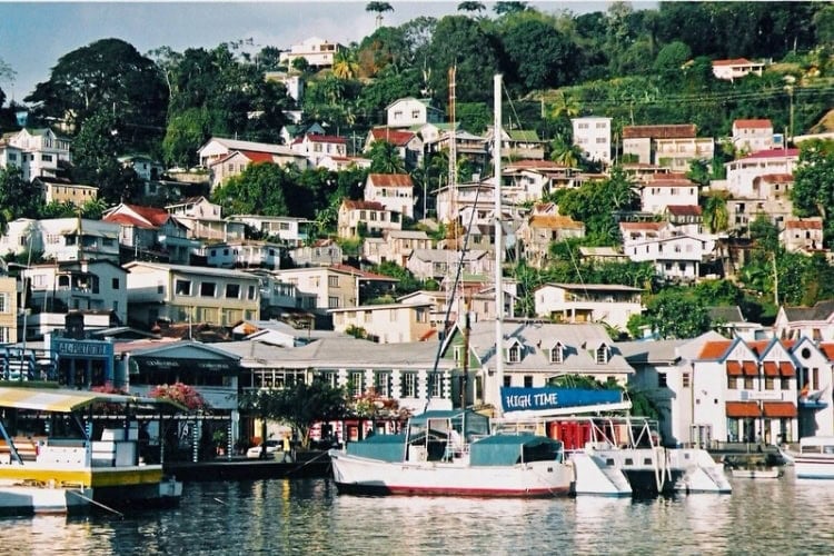 Grenada homes cling to the hillside. Photo by Brent Cassie