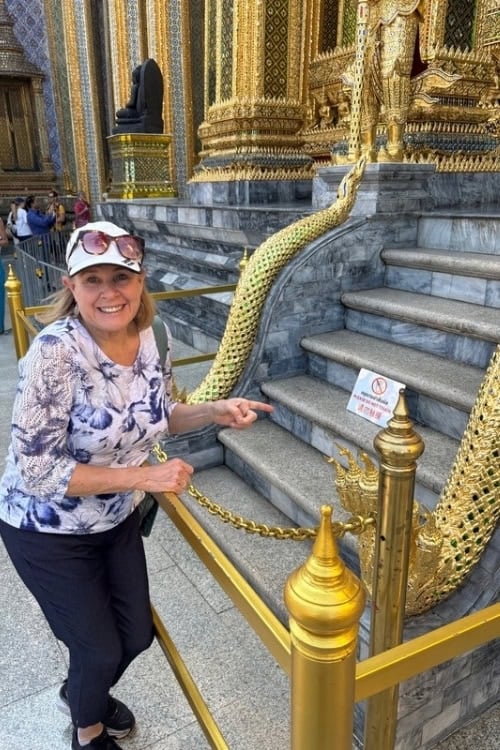 Intricate serpent carvings on temple structures. Photo by Brent Cassie