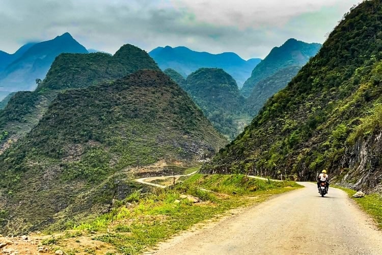 The Ha Giang Loop is one of the most spectacular motorbike routes in the world. It is also exactly the kind of trip where you want travel insurance. Photo by FHimages from Getty Images via Canva