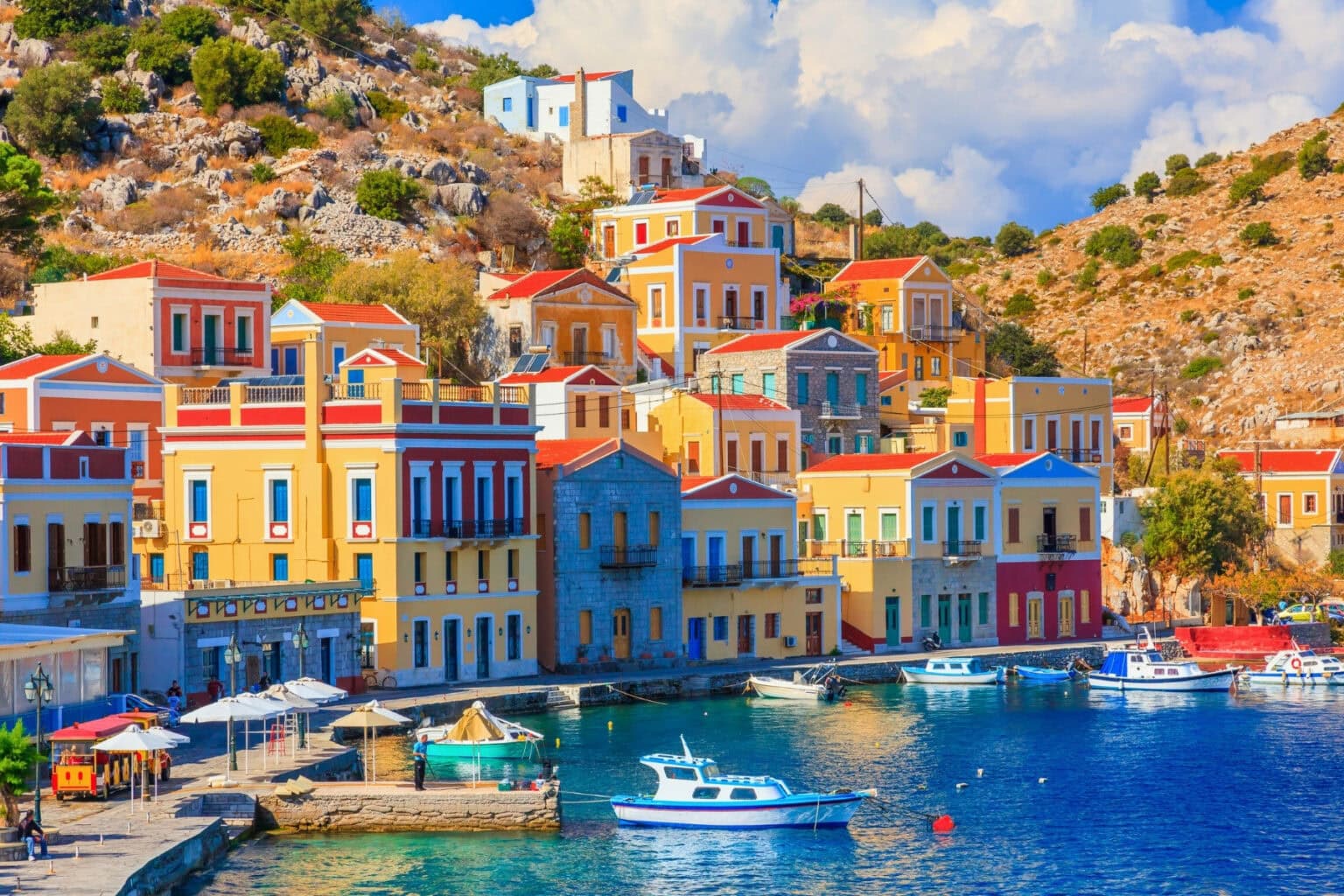 The beautiful Greek island of Symi. Photo by ianwool from Getty Images via Canva