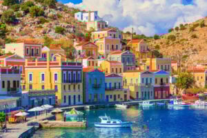 The beautiful Greek island of Symi. Photo by ianwool from Getty Images via Canva