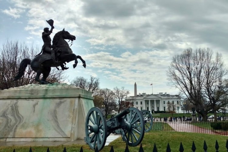 Beyond the statue and cannon, a view of the White House and Washington Monument in Washington, D.C. Photo by Eric D. Goodman