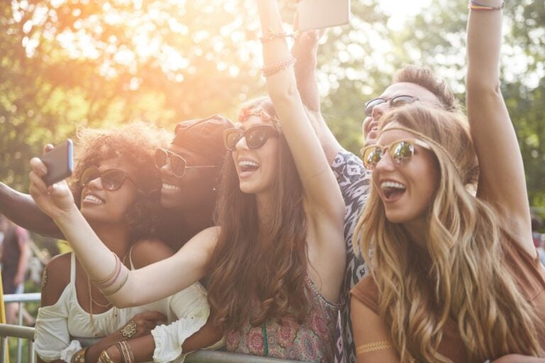 A group of people taking photos of their favorite music star. Photo by Getty Images for Unsplash