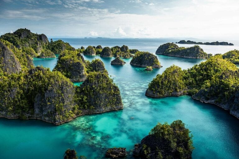Aerial view of a body of water in Raja Ampat, Indonesia. Photo by Simon Spring, Unsplash