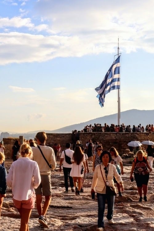 The Greek flag waves proudly above the remains of the former belvedere tower atop the Acropolis high above Athens. It was here that on May 30, 1941, two young men snuck to the top of the Acropolis and removed the Nazi flag. Photo by Kathy Hosek