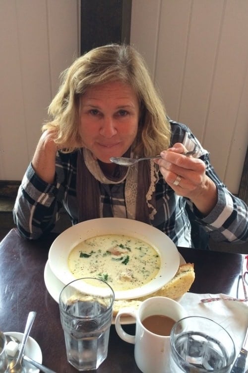 Jane enjoys Rinaldo's seafood chowder. Photo by Brent Cassie