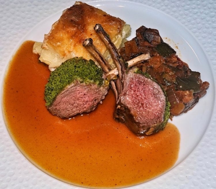 Lamb chops plated cooked to perfection aboard the Oceania Allura. Photo by Tab Hauser