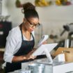 Restaurant shop assistant placing an order into the POS terminal. Photo by Getty Images for Unsplash