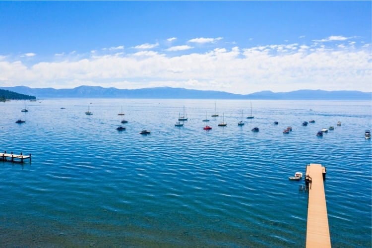 Small boats moored off the shore in South Lake Tahoe. Photo courtesy of Visit California