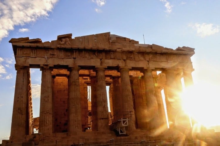 The Parthenon in Athens with the morning sun shining through its massive marble Doric columns. Photo by Frank Hosek