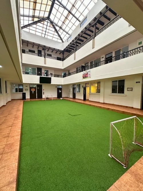 The central atrium of the Local Hope complex in San Mart&iacute;n Chiqu&iacute;to, where classrooms and facilities line each level. Photo by Isabella Miller.