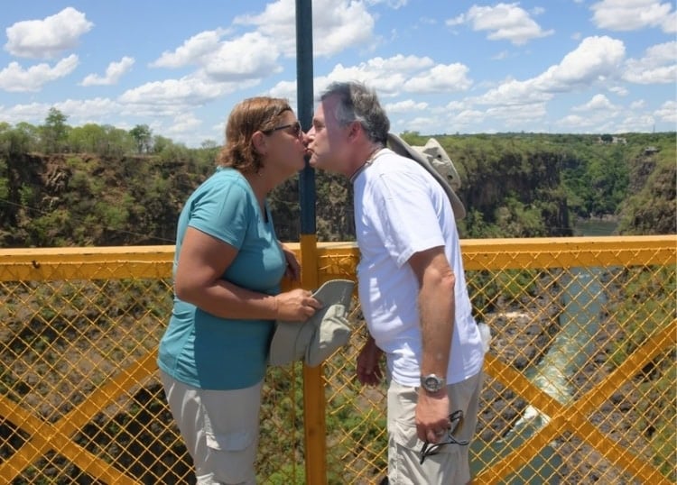A two country kiss on the border at Victoria Falls Bridge. Photo by Tab Hauser