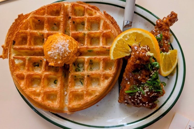 Chicken and waffles with scallion pancake waffles, sambal, and orange chicken. Photo by Craig Stoltz