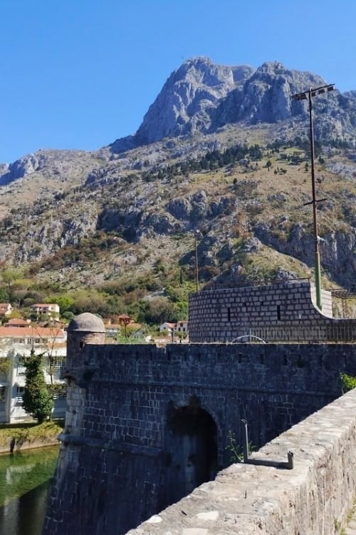 Kotor's city walls seem to become part of the distant mountains. Photo by Eric D. Goodman