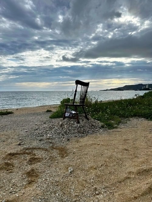 A lone reading chair on the local beach in Nago, Okinawa. Photo by Liv Headley