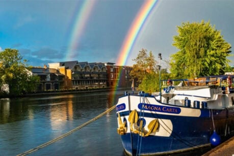 A double rainbow frames the Magna Carta Barge as it is docked in Windsor. Photo by Rose Palmer
