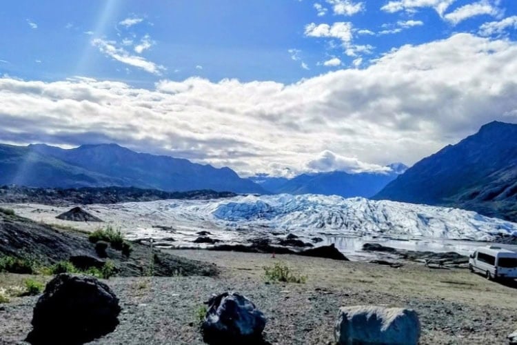 Exploring a Matanuska ice field with glacial debris. Photo by Dorothy Maillet