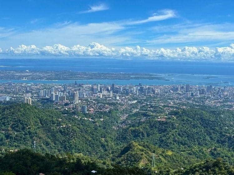Panoramic view of Cebu City from Tops Lookout, with Mactan Island visible in the distance. Photo by Nikola Mikovic