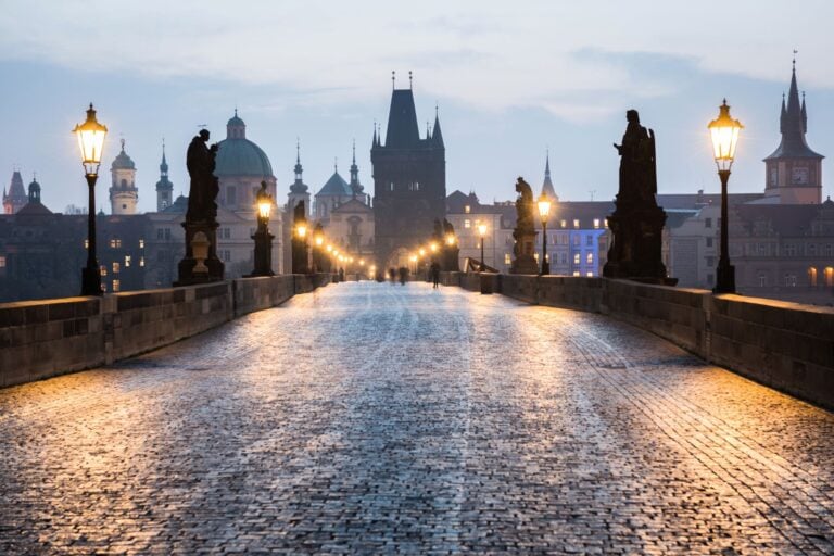 The famous Charles Bridge in Prague is still beautiful in the rain. Image by tichr from Getty Images via Canva