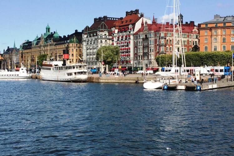 Long boats equipped to handle the tourist trade in Stockholm. Photo by Brent Cassie