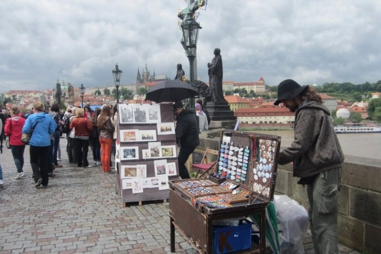 Vendor sells tourist fare on the bridge. Photo by Brent Cassie