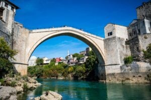 Stari Most Bridge in Mostar is just one of the amazing sights in the Balkans. Image by MEHMET KAYNAR from Pexels via Canva