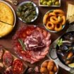 Experience Barcelona through its delicious food. Image by StarpStock from Getty Images via Canva