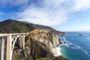 Big Sur offers a classicly stunning coastal road trip in California. Image by 4kodiak from Getty Images Signature via Canva