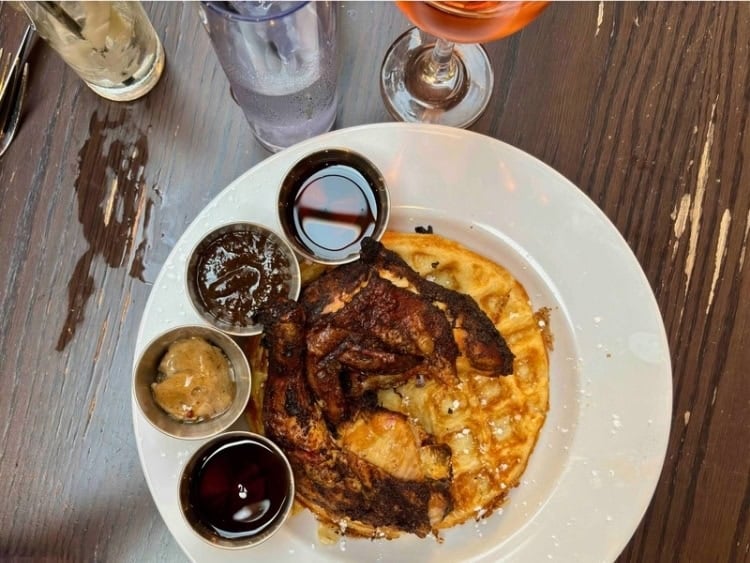 Chicken and waffles at Hyde Park Caribbean restaurant 14 Parish, famous for its jerk catfish and red snapper escovitch. Photo by Doug Wallace