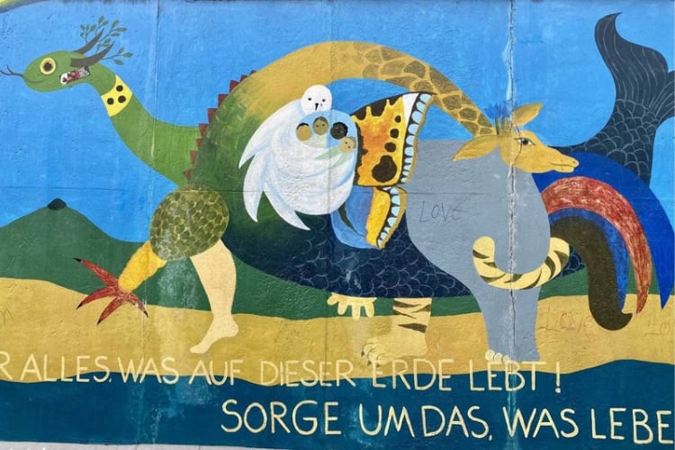 Colorful murals transform a former barrier. Photo by Huyen Tran
