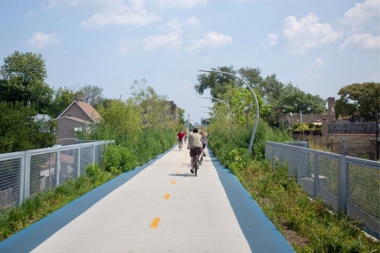 Cyclists on The 606, a tranquil walking and cycling path along what was once an elevated railway bringing goods into the center of Chicago. Photo by Victor Grigas