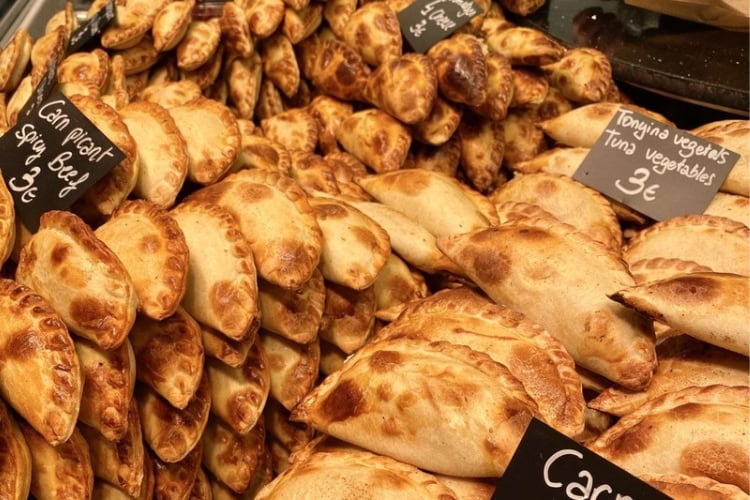 Golden empanadas filled with savory local ingredients. Photo by Huyen Tran