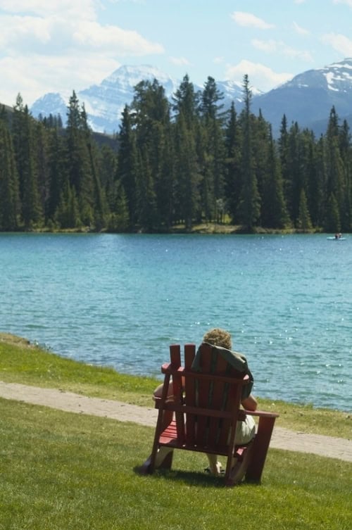 Jasper Park Lodge relaxation time overlooking the mountains. Photo by Brent Cassie