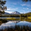 Lassen Peak reflects in Manzanita Lake at Lassen Volcanic National Park in California. Photo by Teri K. Miller