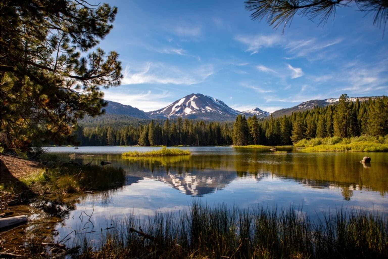 Lassen Peak reflects in Manzanita Lake at Lassen Volcanic National Park in California. Photo by Teri K. Miller